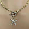 Micro Pave starfish pendant on Chunky gold rope chain. Micro pave toggle clasp