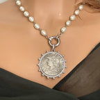 Reproduction Silver French Coin Pendant on a porcelain Pearl chain.