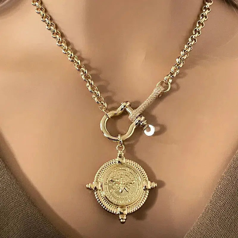 Gold French bee Pendant on a gold Rolo Chain with a CZ Shackle and connector